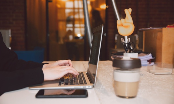 virtual assistant working on a laptop