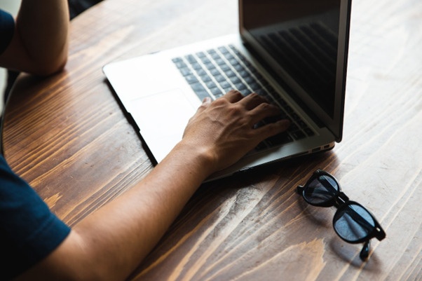 virtual assistant managing their tasks on a laptop