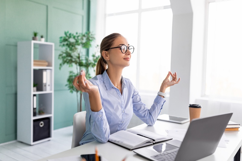 A person meditating or exercising outdoors, symbolising the importance of health and balance in maintaining personal well-being while growing a business.