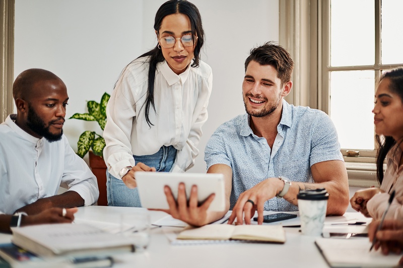 Smiling employee confidently sharing ideas during an online team meeting.