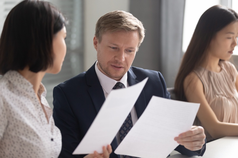 A leader reviewing tasks, marking those suitable for delegation, representing task prioritisation for business growth