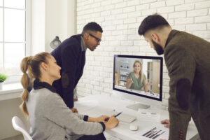 team members collaborating on a video call, symbolising trust and teamwork in a remote environment