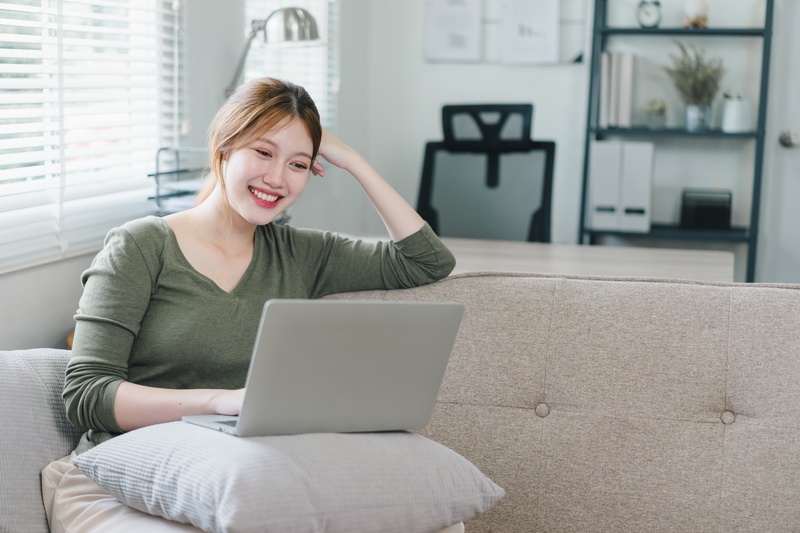 Smiling entrepreneur multitasking at work.